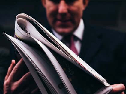 man reading paper.jpg